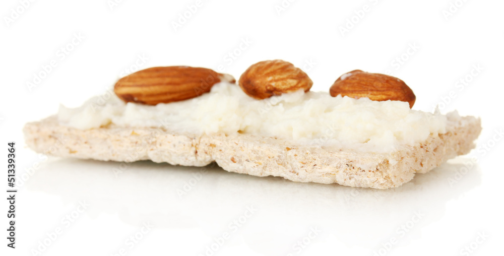 Crispbread with milk cheese and almond, isolated on white