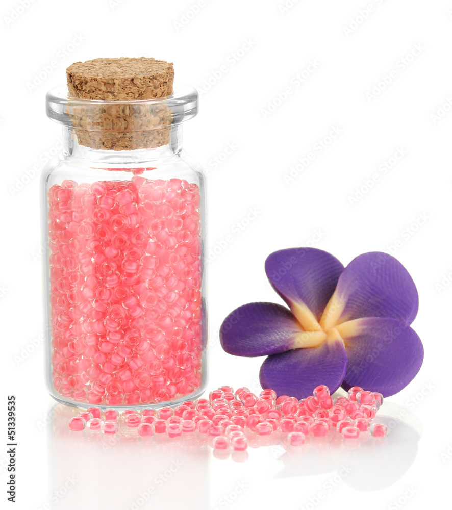 Little bottle full with colorful beads isolated on white Little bottle full with colorful beads isolated on white