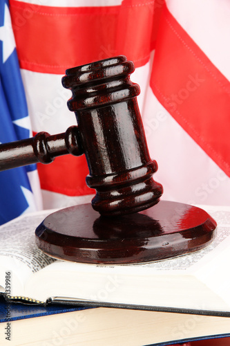 Judge gavel and books on american flag background