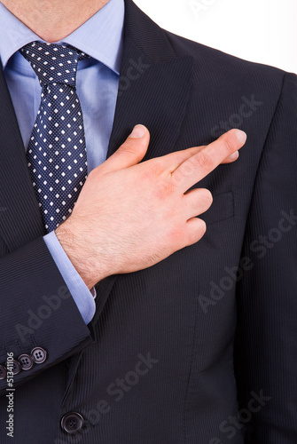 Canvas Print Business man with fingers crossed.