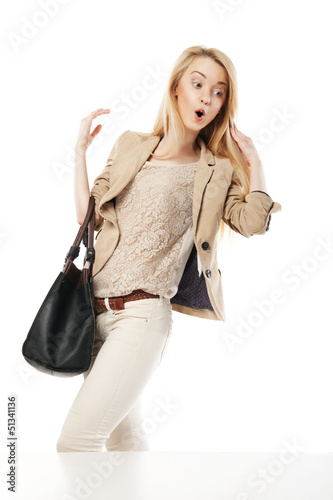 Young excited woman looking at the shop window