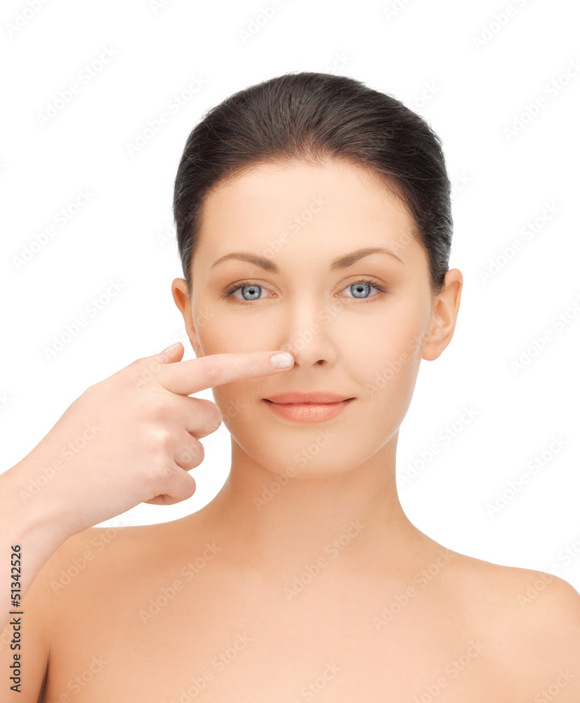 woman touching her nose woman touching her nose