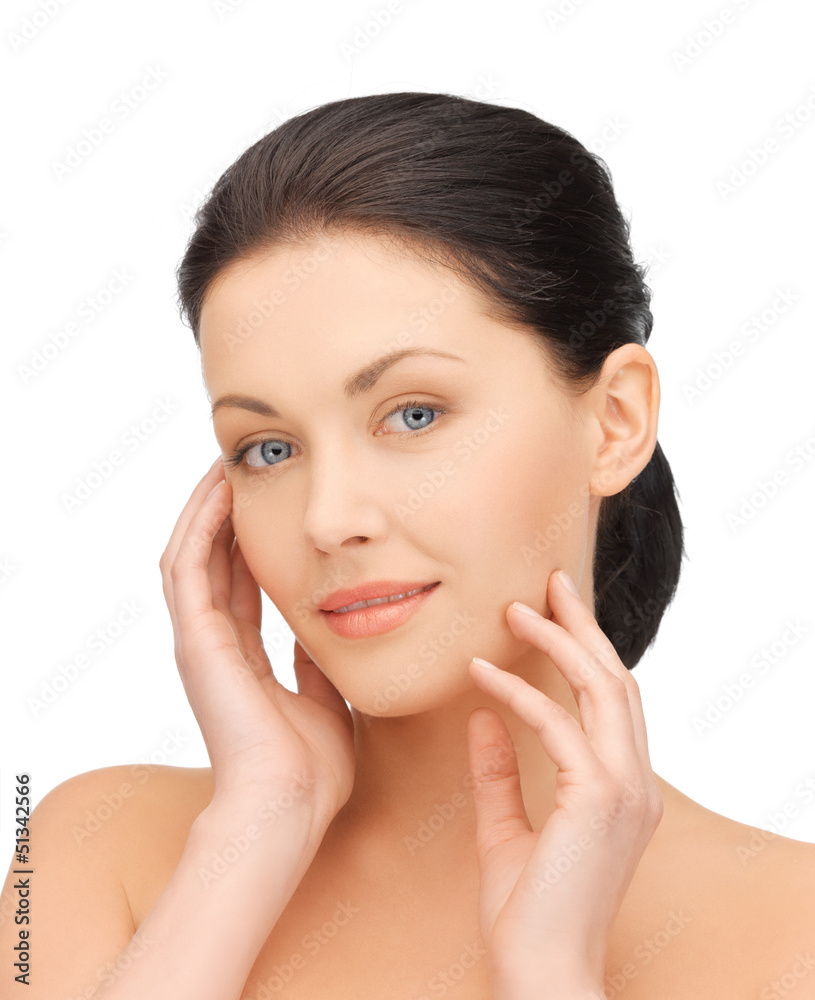 woman touching her face woman touching her face