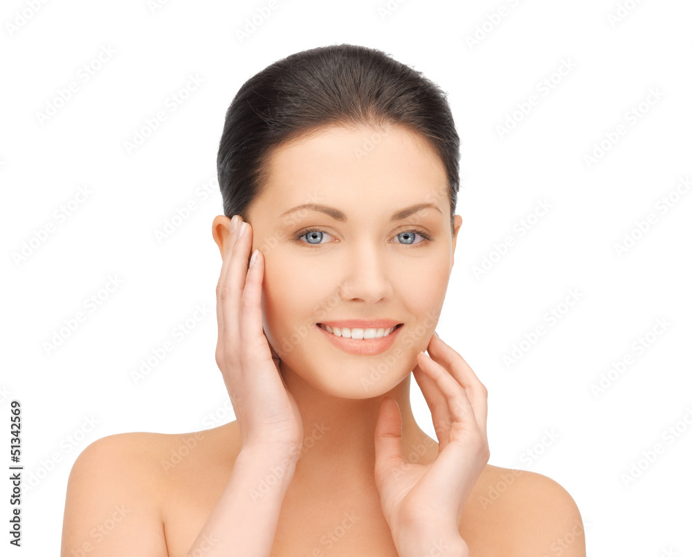woman touching her face woman touching her face