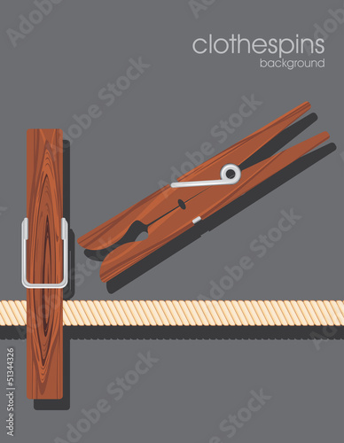 Wooden clothespins on the dark gray background