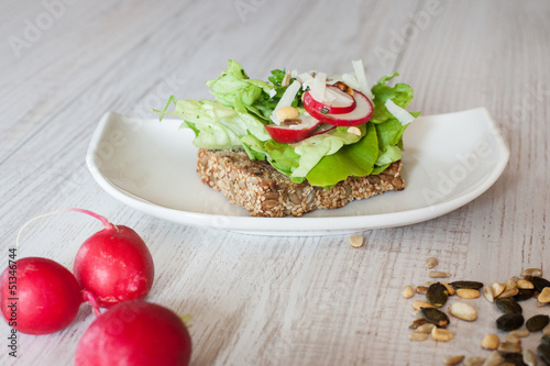 Radishes with healthy sandwich with salad