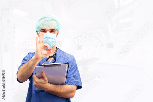 Doctor physician approval OK hand sign isolated in operating roo photo