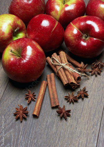 Fresh red apples with cinnamon and anise