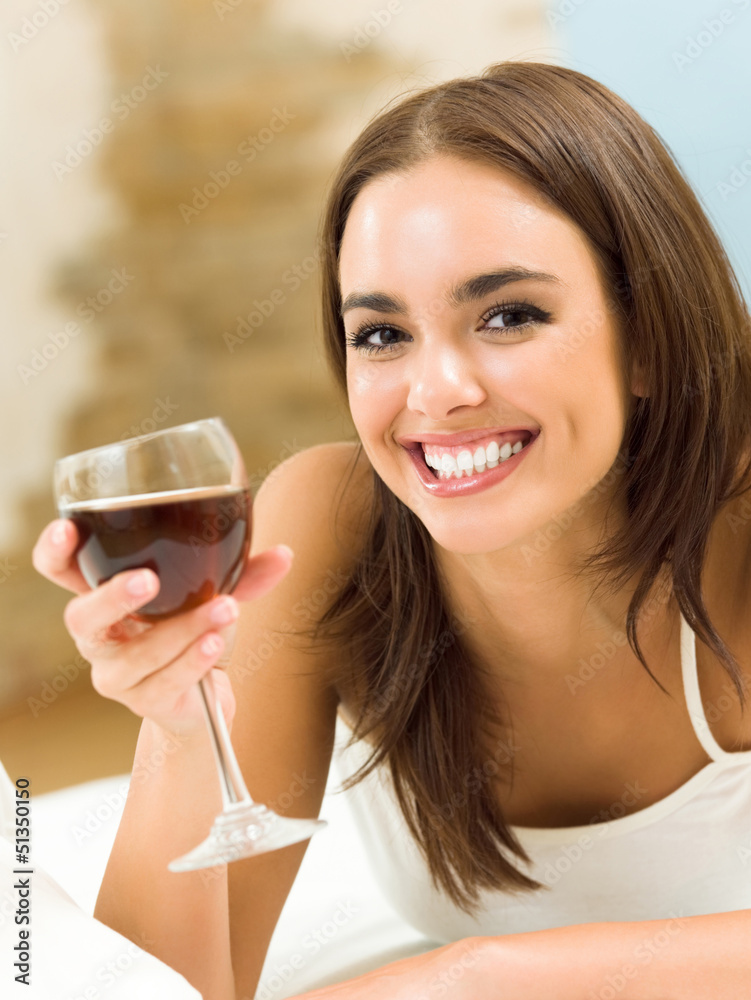Young woman with glass of redwine Young woman with glass of redwine