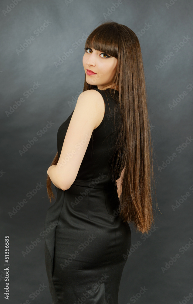 Portrait of a young beautiful woman with bangs in studio Portrait of a young beautiful woman with bangs in studio