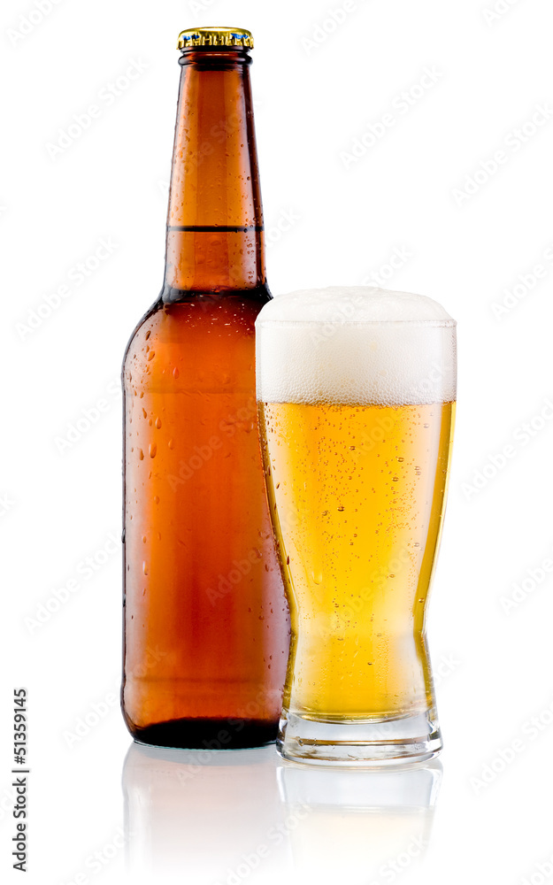 Glass of beer and Brown bottle with drops isolated on a white ba