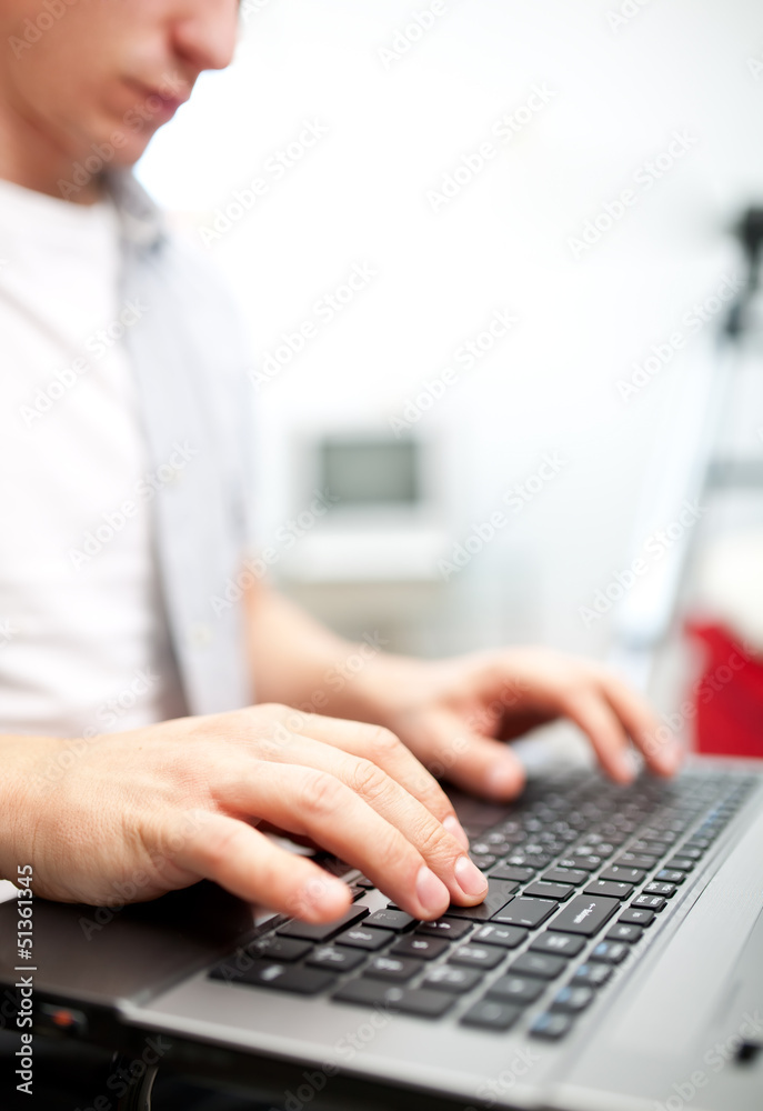 Man working on the laptop at home Man working on the laptop at home
