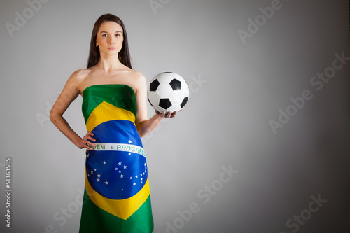 woman in the Brazilian flag and soccer ball photo