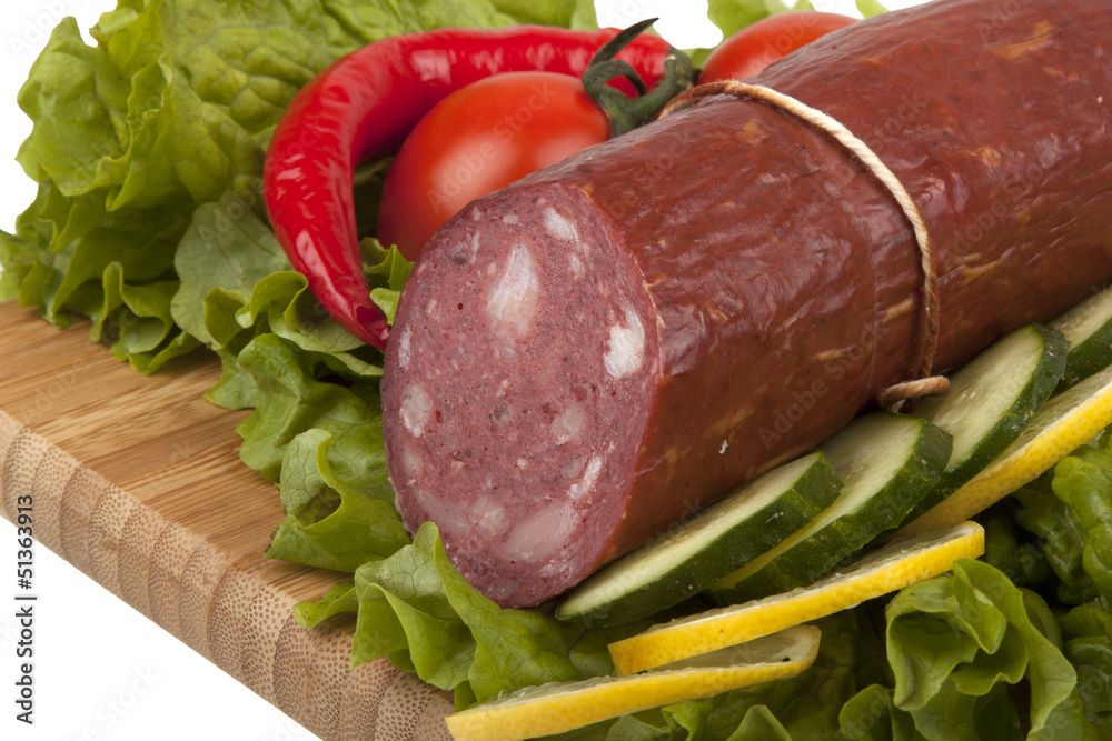 Sausage with vegetables on board Sausage with vegetables on board