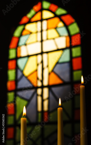 Prayer Candles And Stained Glass Church Window