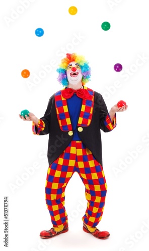 Billede på lærred Juggler clown throwing colorful balls