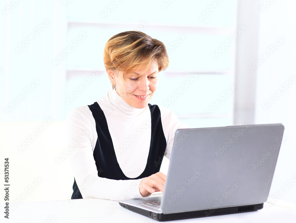Beautiful and charming business woman for a laptop. Beautiful and charming business woman for a laptop.