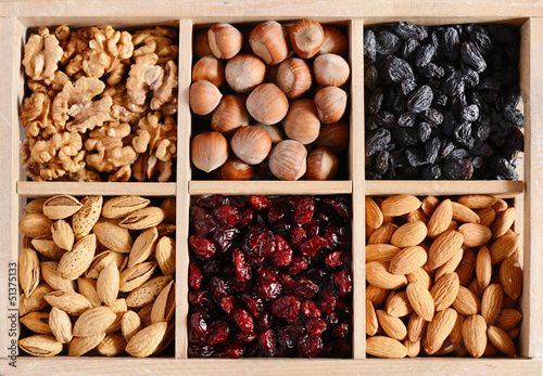 Nuts and dried fruits mix in wooden box
