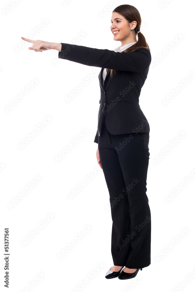 Corporate smiling woman pointing at something Corporate smiling woman pointing at something