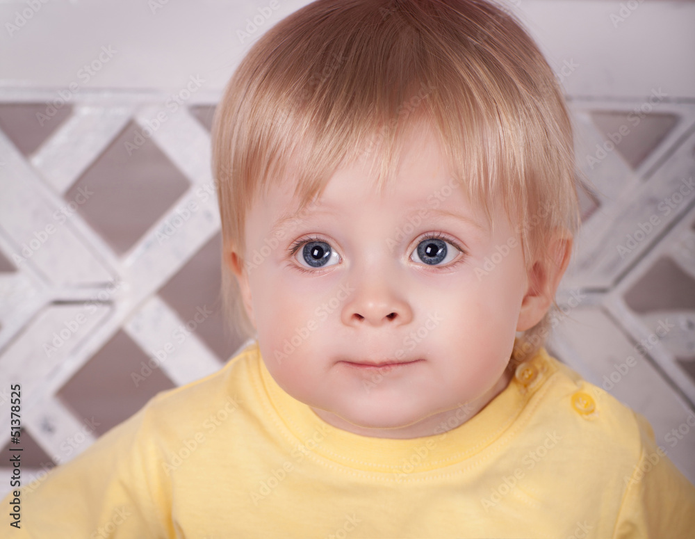 funny lovely baby boy little child in trendy jeans.