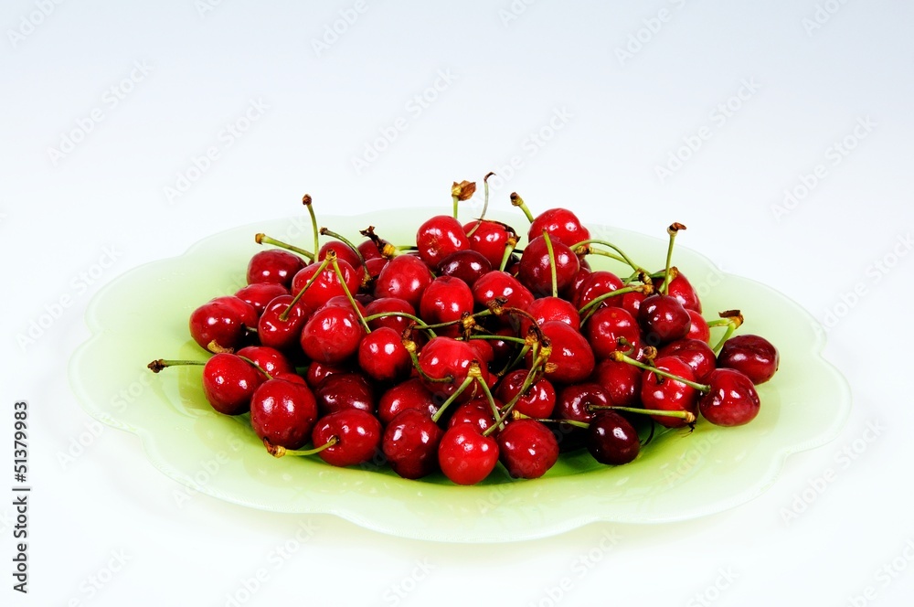 Fresh red cherries on green plate © Arena Photo UK Fresh red cherries on green plate © Arena Photo UK