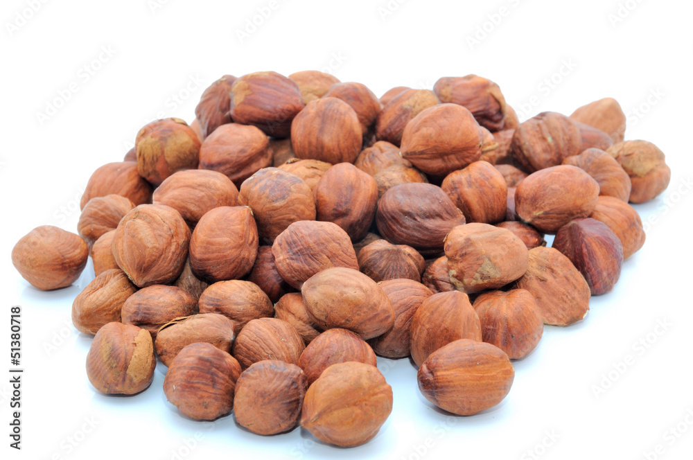 Isolated handful of brown clean cores of hazelnut Isolated handful of brown clean cores of hazelnut