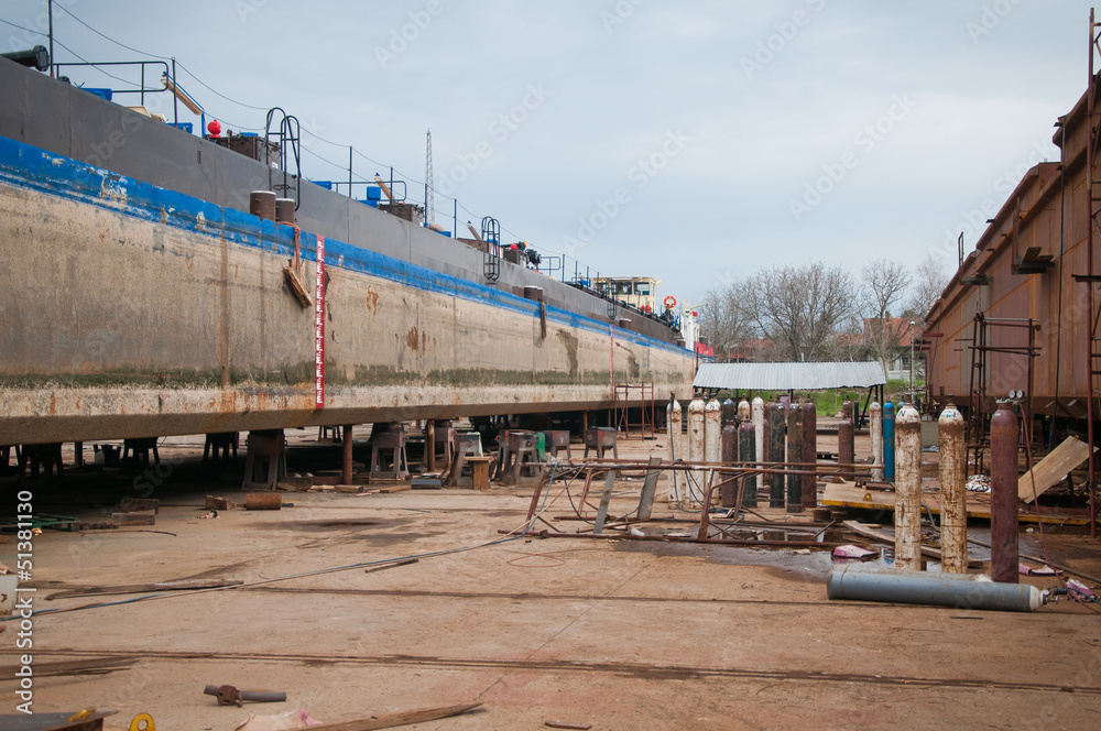 Ship and monumental crane in the shipyard Ship and monumental crane in the shipyard