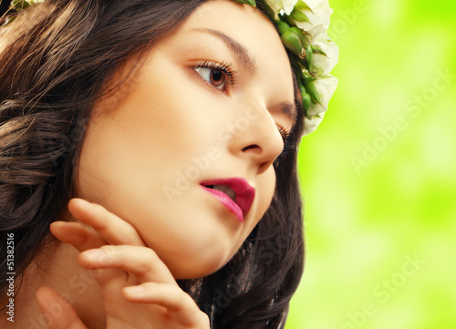 beauty woman with flower on green
