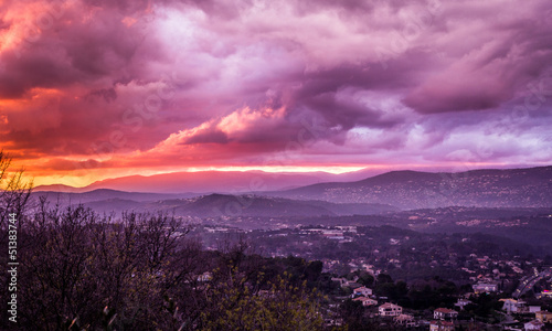 Unusual red sunset with the view of Alps in Mougins, France © valarphoto