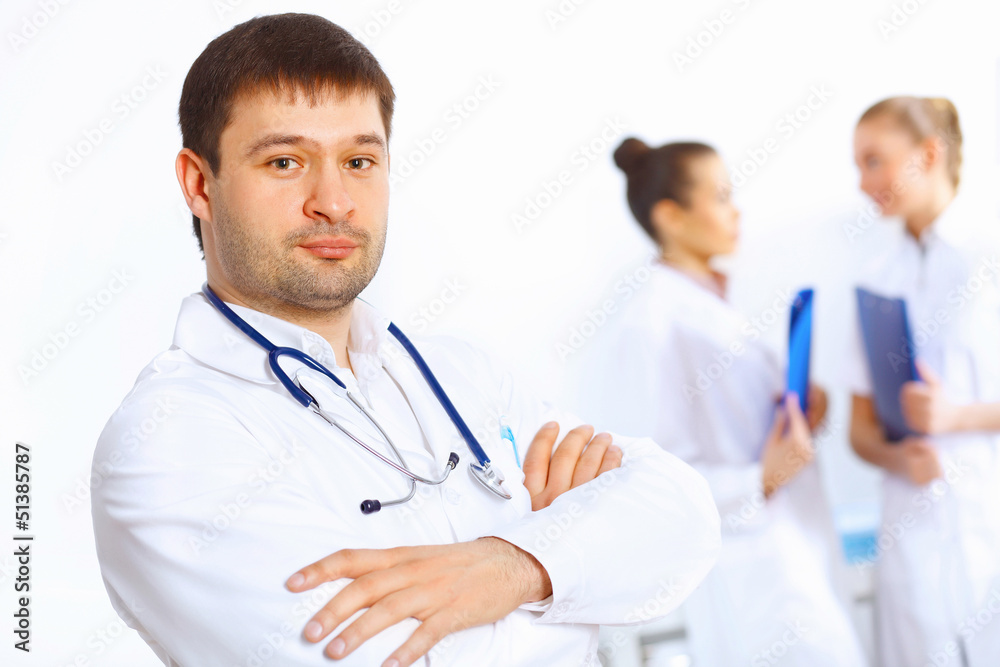 Young male doctor in white uniform Young male doctor in white uniform