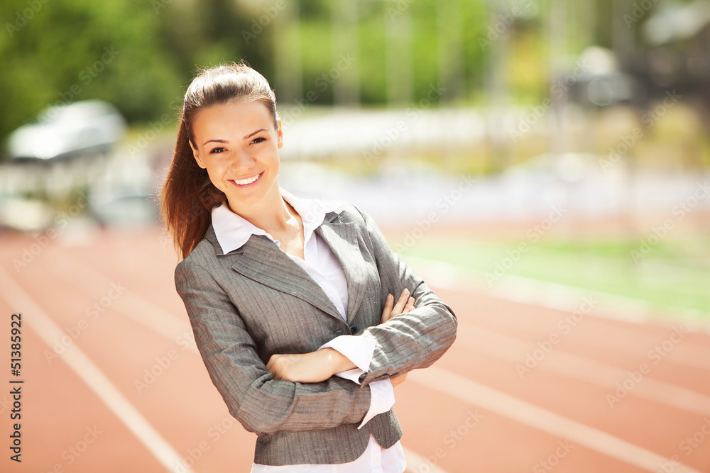 Business woman at athletic stadium Business woman at athletic stadium