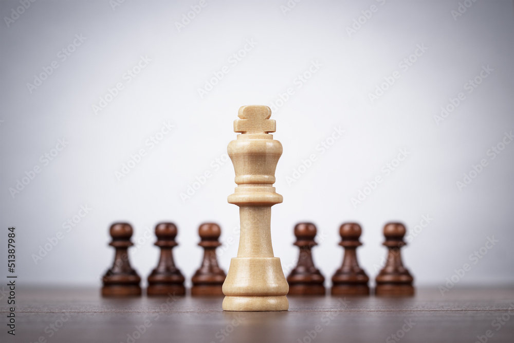 chess leadership concept over grey background