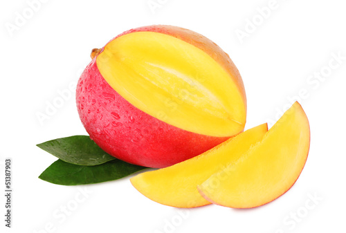 One ripe mango and two slices with drops  isolated 