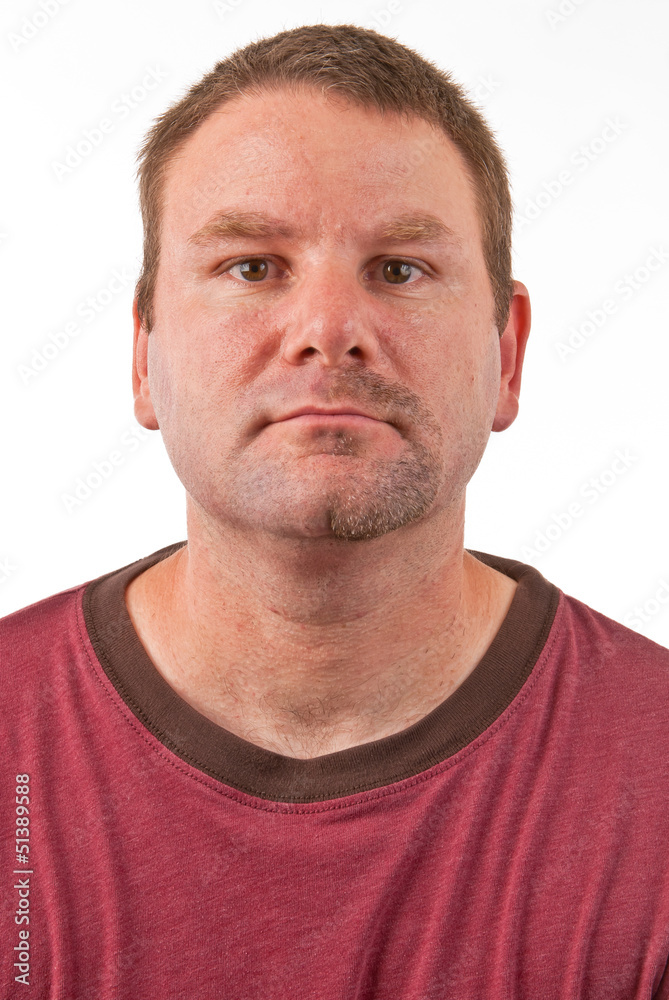 Caucasian male with a half shaven goatee facing forward Caucasian male with a half shaven goatee facing forward