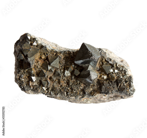 Magnetite crystals in the stone on white background photo