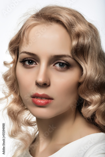 beautiful blonde girl on white background close-up