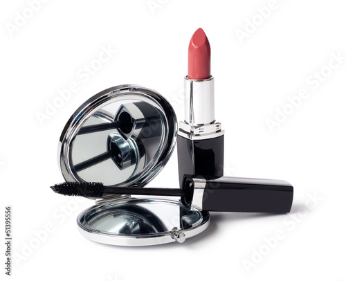 Red lipstick and mirror on white background photo