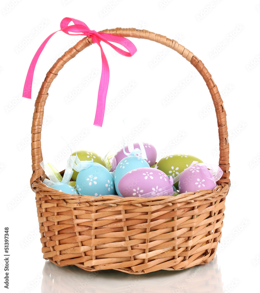 Colorful easter eggs in basket isolated on white Colorful easter eggs in basket isolated on white