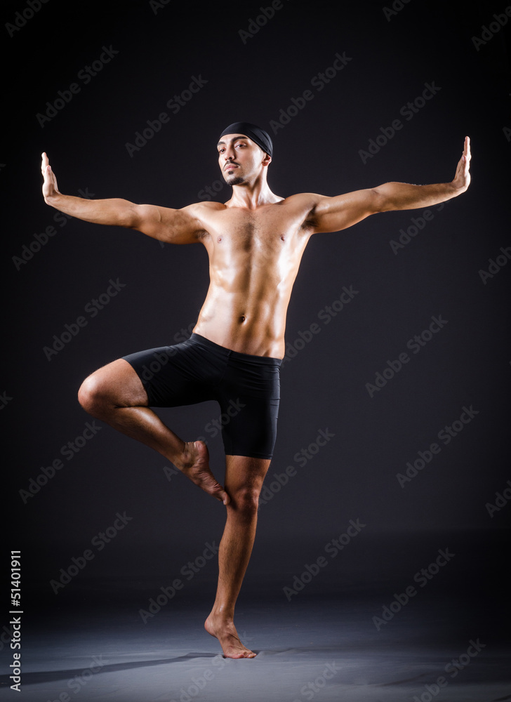 Dancer dancing in the dark studio