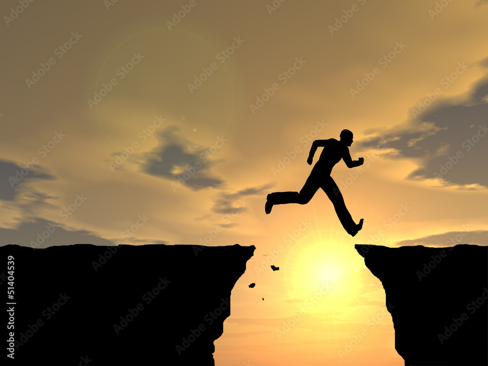 Conceptual happy man jumping over sunset Conceptual happy man jumping over sunset