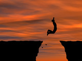 Conceptual happy man jumping over sunset