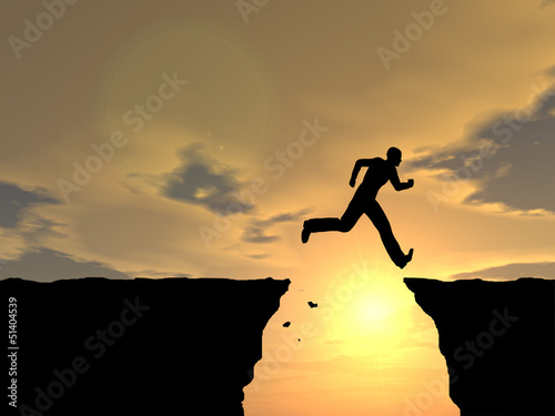 Conceptual happy man jumping over sunset