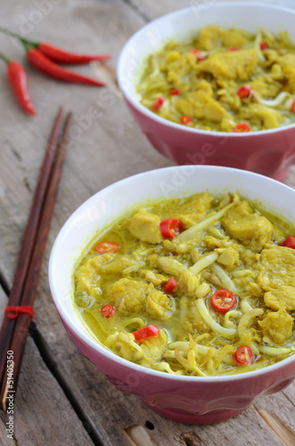 Two bowls with laksa lemak - malaysian noodle soup