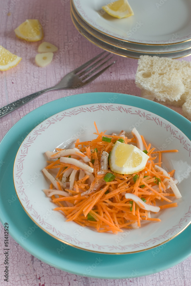 Salad with squid, carrots, garlic
