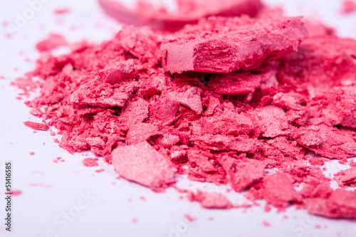 close up of a  make-up accessories -powder, eyeshadow,lipstick