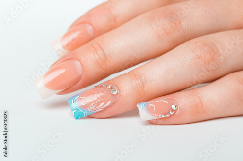 Beautiful female hands with french manicure photo