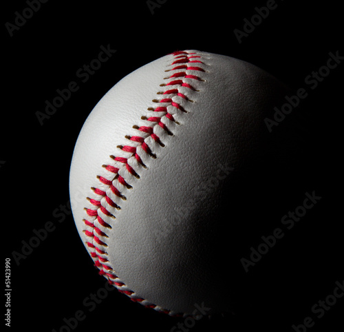 Baseball on black background