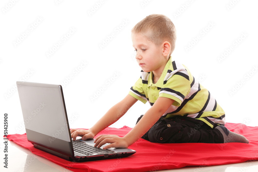 Computer addiction child with laptop notebook Computer addiction child with laptop notebook