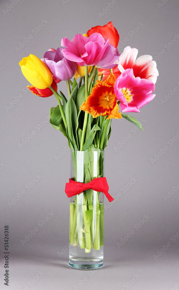 Fototapeta Beautiful tulips in bouquet on gray background