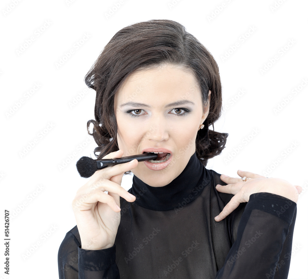 Beautiful woman with makeup brush near her face Beautiful woman with makeup brush near her face